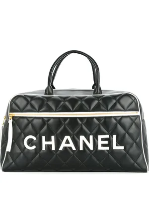 CHANEL Quilted luggage handbag