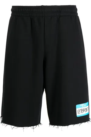 Vetements Logo-print frayed track shorts