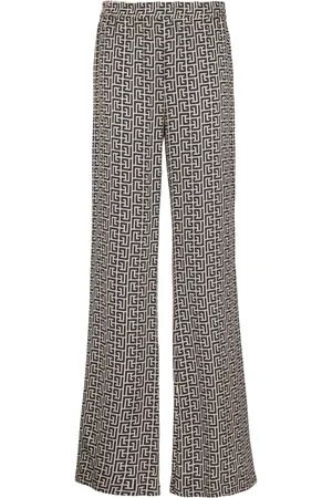 Balmain Monogram-pattern trousers