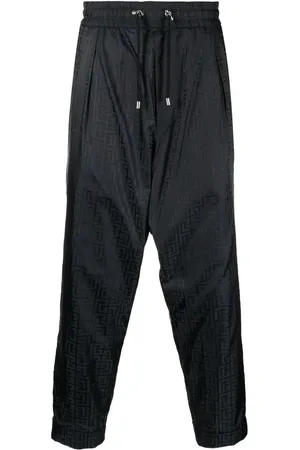 Balmain Monogram-print tapered trousers