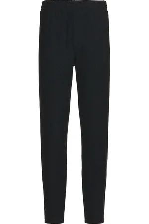 Beyond Yoga Take It Easy Pant in - Black. Size L (also in M, S, XL/1X).