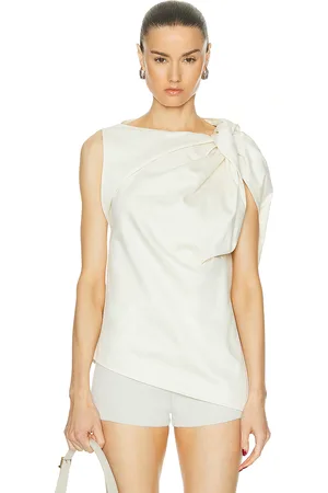Totême Shoulder Twist Satin Top in - Cream. Size 32 (also in ).