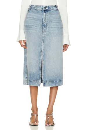 Khaite Charlene Skirt in - Denim-Light. Size 27 (also in 28, 29, 30, 31).