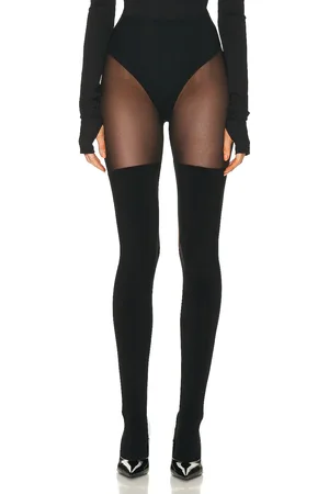 Norma Kamali Thigh High Spliced Legging in - Black. Size L (also in M, S, XL, XS).