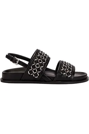 Alaïa Eyelet Slingback Sandals in - Black. Size 35 (also in 37.5, 40.5).