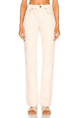 GRLFRND Melanie High Rise Boot Cut in - Beige. Size 23 (also in 29, 30, 31, 32).