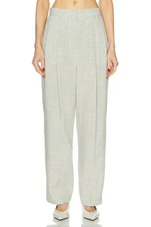 Totême Double Pleated Tailored Trouser in - Light Grey. Size 32 (also in ).