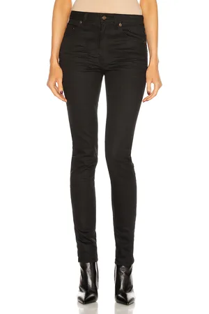 Saint Laurent Medium Waist Skinny Jean in - Black. Size 24 (also in 25, 28).