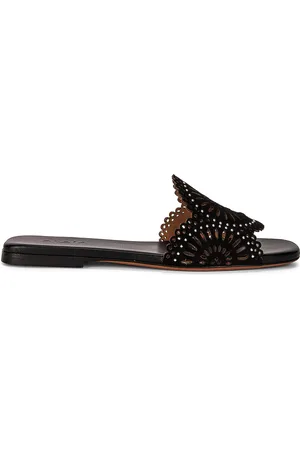 Alaïa Perforated Molukai Mules in - Black. Size 36 (also in ).