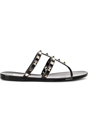 VALENTINO GARAVANI Summer Rockstud PVC Thong Sandal in - Black. Size 36 (also in 38, 39, 40, 41).