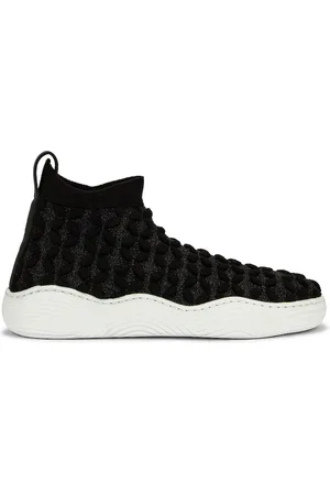 Alaïa Petal Sneakers in - Black. Size 36 (also in 37, 39, 40, 41).