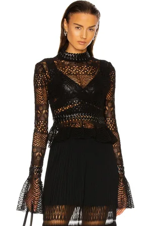 Alaïa Fitted Long Sleeve Top in - Black. Size 40 (also in ).