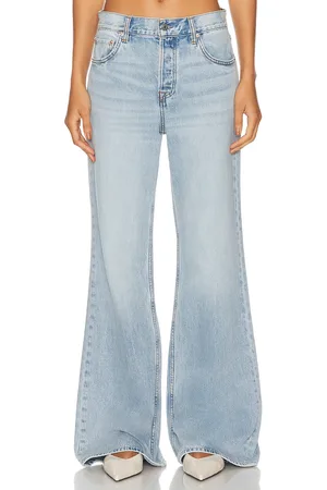 GRLFRND X Maggie MacDonald Jade Low Rise Relaxed Flare in - Denim-Light. Size 26 (also in 27, 30, 31, 32).