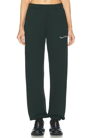 Museum of Peace and Quiet Wordmark Sweatpants in - Dark Green. Size M (also in S, XL/1X, XS).