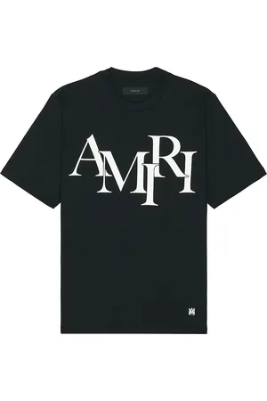 AMIRI Staggered Logo Tee in - . Size L (also in M, XL/1X).