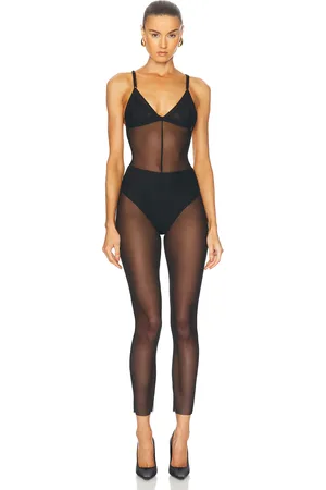Norma Kamali Low Back Fara Slip Catsuit in - Black. Size L (also in M, S, XL, XS).