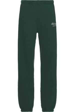 Sporty & Rich X Hotel Carlyle Script Embroidered Sweatpant in - Dark Green. Size L (also in M, S, XL/1X).