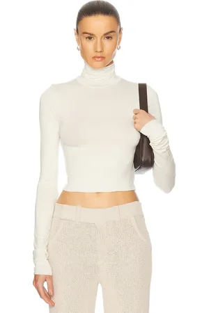 ÉTERNE Cropped Fitted Turtleneck Top in - . Size L (also in M, S, XL, XS).
