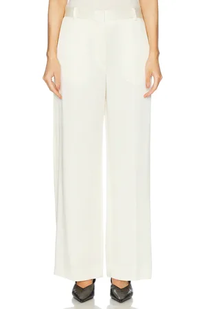 Totême Cuff Slit Trouser in - Cream. Size 34 (also in 36, 38, 40).