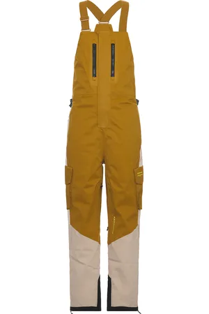 Whitespace 2L Cargo Insulated Bib Pant in - mustard. Size L (also in M, S, XL/1X).