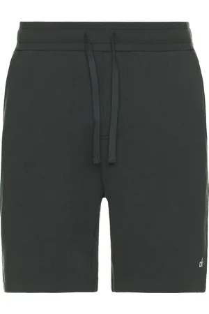alo Chill Short in - Dark Green. Size L (also in M, S, XL/1X).