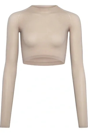 Alaïa Long Sleeve Crop Top in - Beige. Size 34 (also in ).
