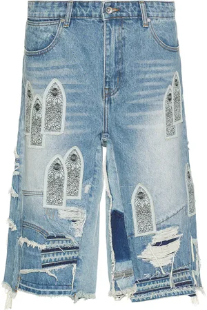 Who Decides War by Ev Bravado Patched Arch Blowout Denim Short in - Blue. Size 30 (also in 32, 34, 36).