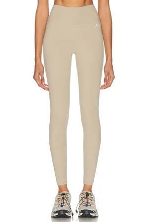 Sporty & Rich Runner Legging in - Taupe. Size M (also in ).