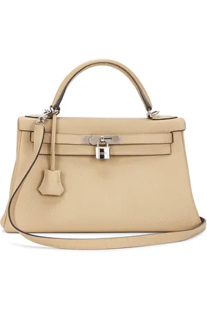Hermès Togo Kelly 28 Handbag in - Beige. Size all.