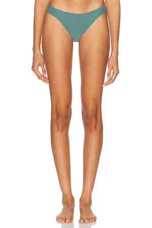 Tropic of C Curve Bikini Bottom in - Teal. Size L (also in M, S, XS).