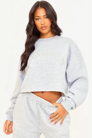 PRETTYLITTLETHING Tall Distressed Varsity Cropped Sweatshirt