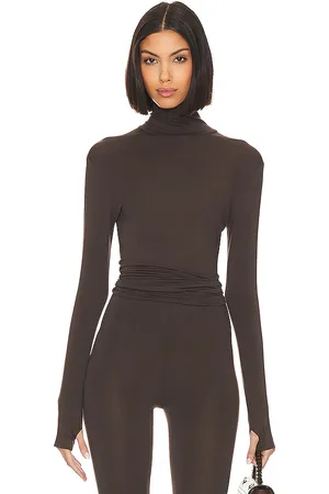 Norma Kamali Slim Fit Long Sleeve Turtle Top in . Size M, S, XL, XS, XXS.