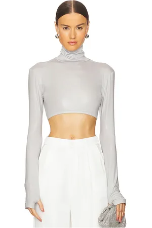 Norma Kamali Cropped Slim Fit Long Sleeve Turtleneck Top in . Size S, XL, XS, XXS.