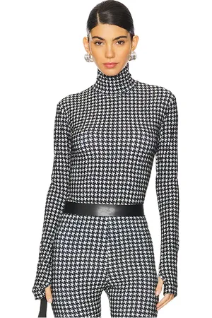 Norma Kamali Slim Fit Long Sleeve Turtleneck Top in Black,White. Size XXS.