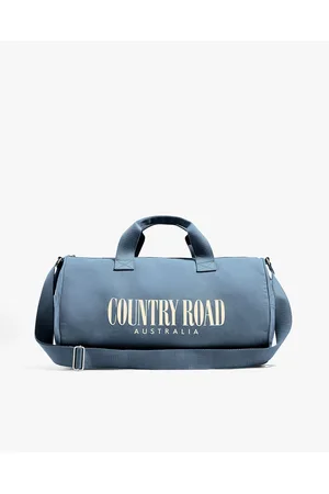 Recently Accepted Business Student Treats Herself To Country Road Duffle Bag  — The Betoota Advocate